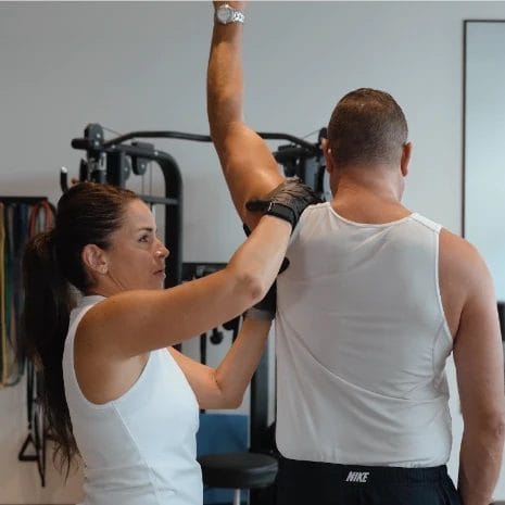 Man on physical therapy with therapist at BodyFit Physical Therapy